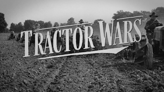 Tractor Wars title words over a black and white photo of six old tractors in formation driving through a dirt field towards the camera.