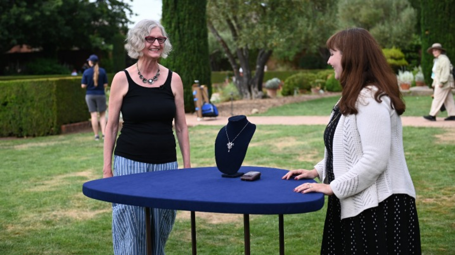 Kailtlin Shinnick (right) appraises a Belle Epoque diamond & platinum necklace, ca. 1905, in Woodside, California