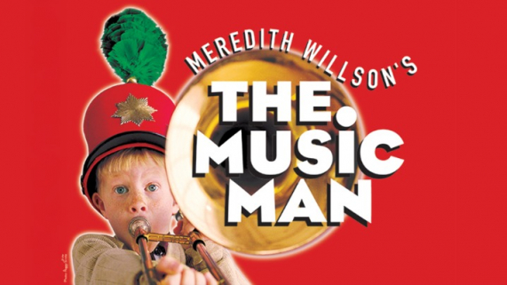 A young boy playing an instrument with the text The Music Man