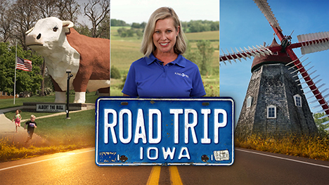 A giant stature of a bull, Brooke Kohlsdorf (host), a Danish windmill and Road Trip Iowa logo above a sunlit two lane highway.