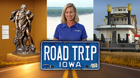 A museum bronze statue of two people draped in a windblown cloth, Brooke Kohlsdorf (host), a "City of Clinton Showboat" docked riverboat and Road Trip Iowa logo above a sunlit two lane highway.