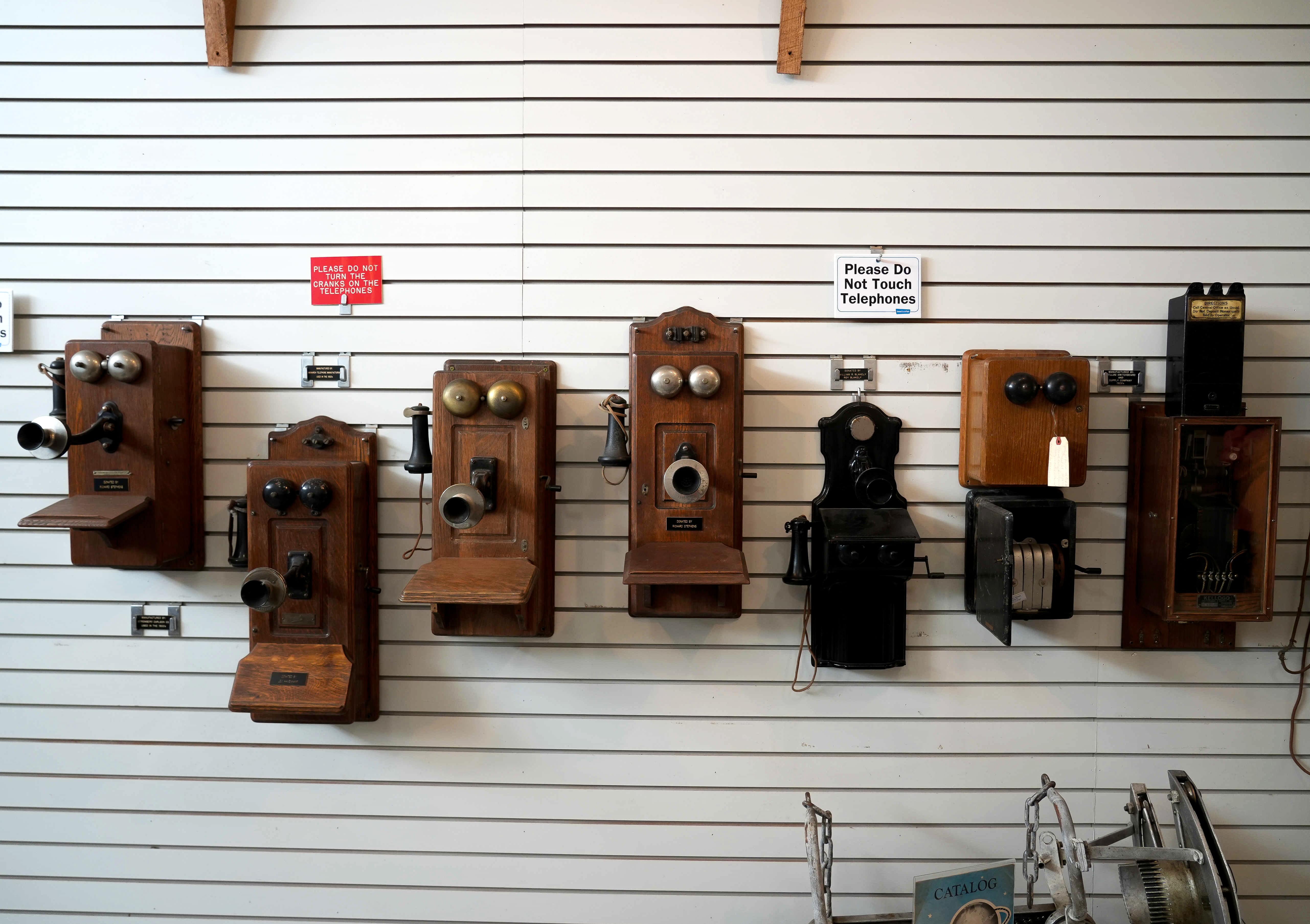 wall of vintage phones