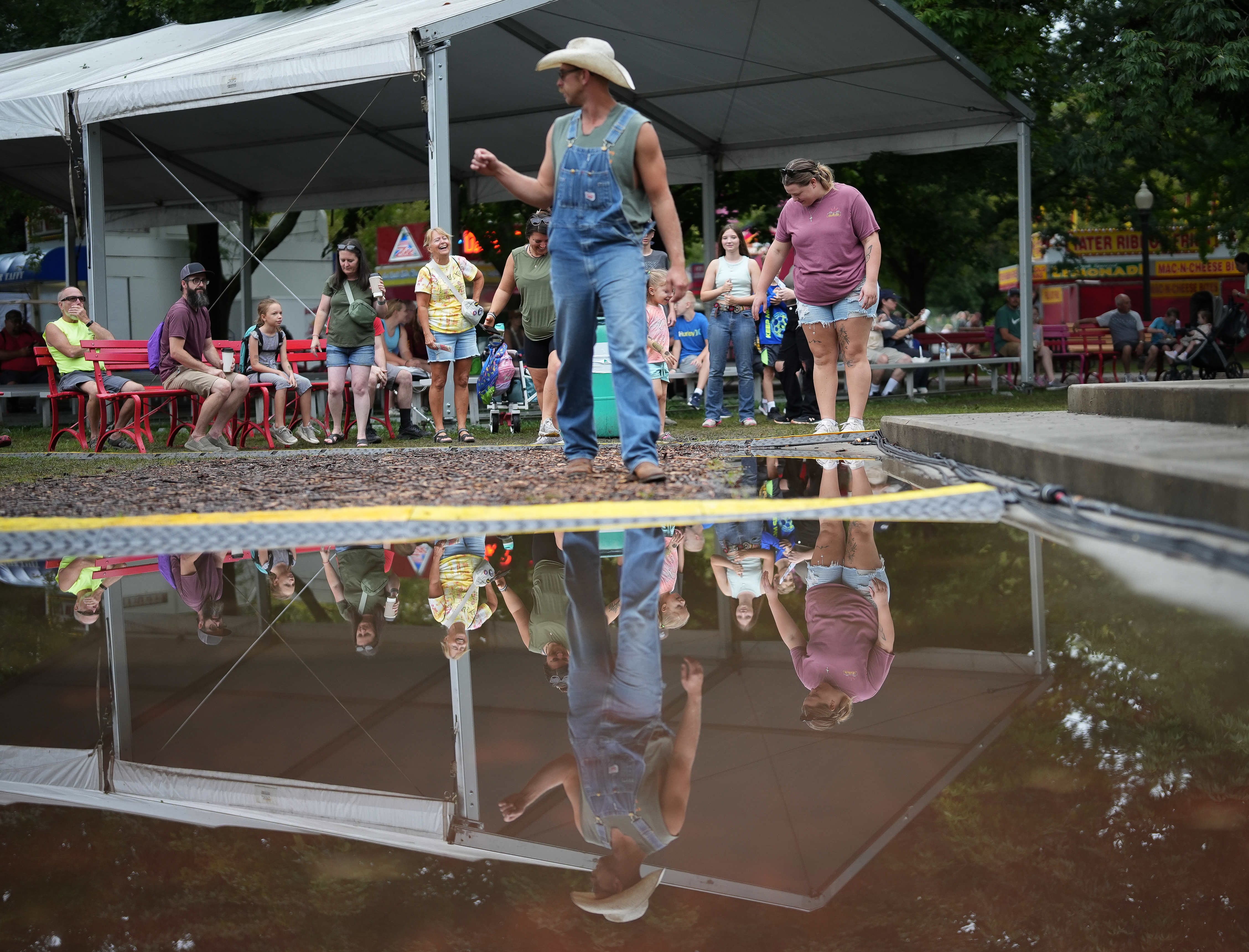 Rain soaked the grounds and left water puddled up in areas of the fairgrounds.