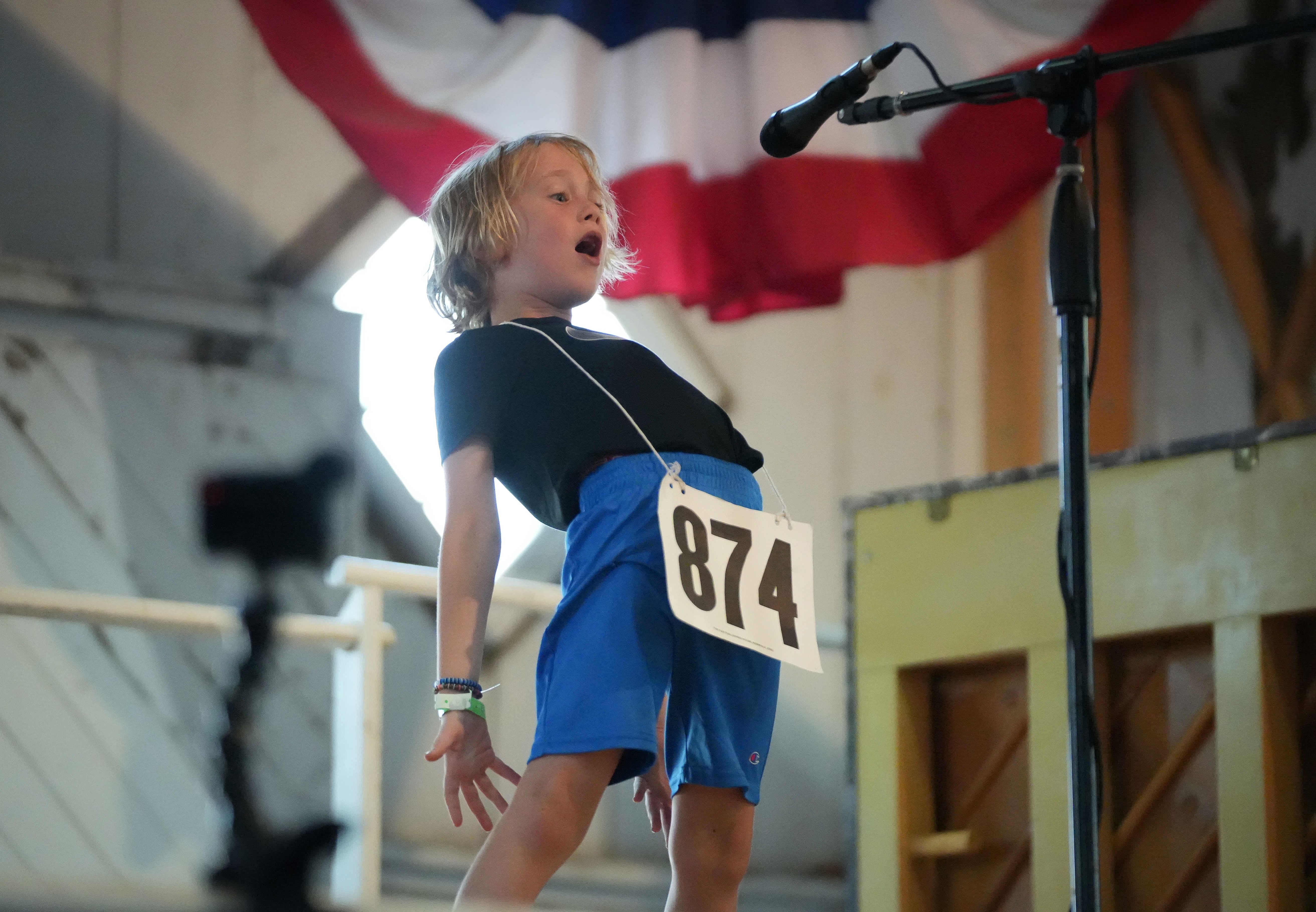 Kid bends over backward at the Mom Calling Contest.