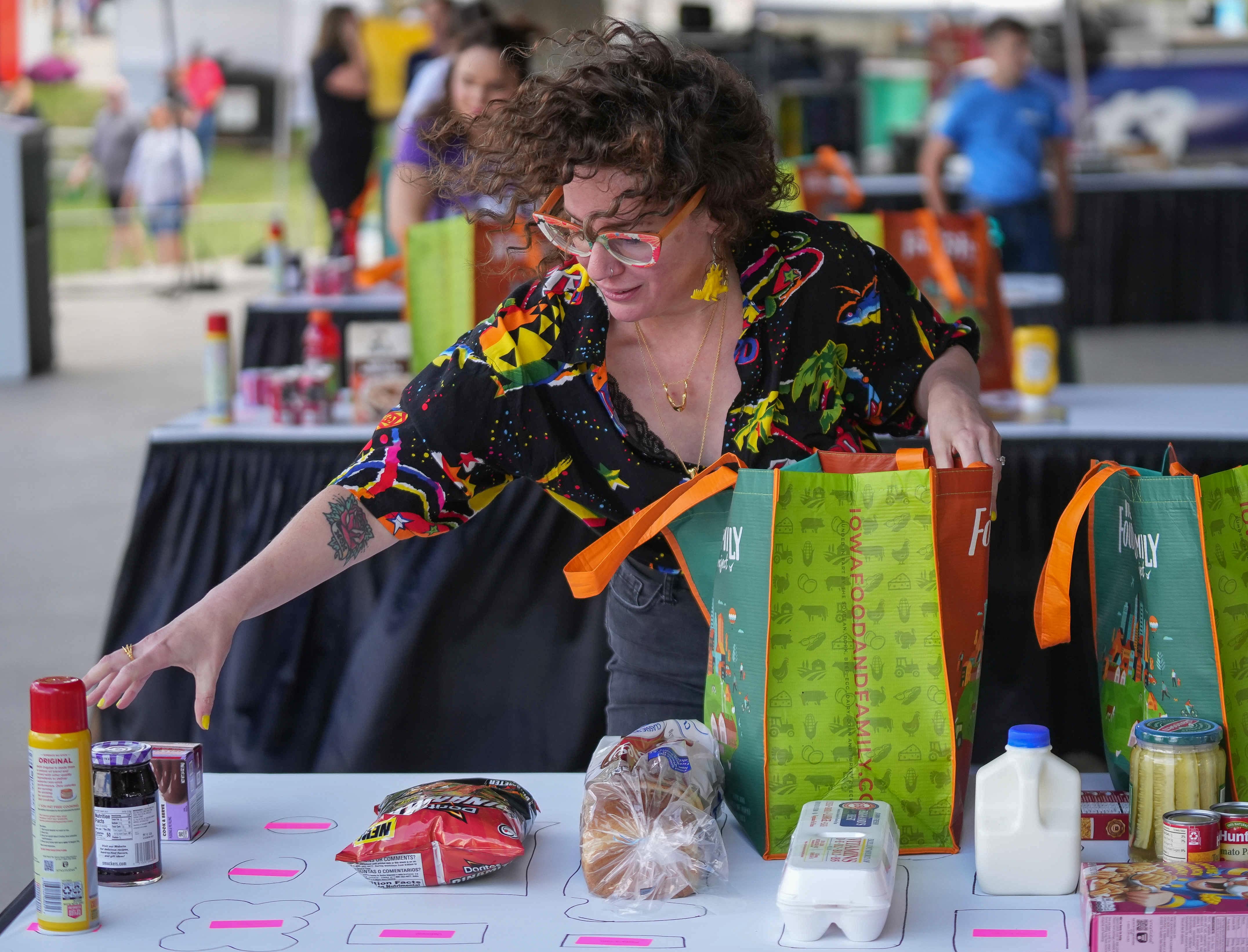 A contestant swiftly - and carefully - puts away groceries in the Best Bagger contest. 