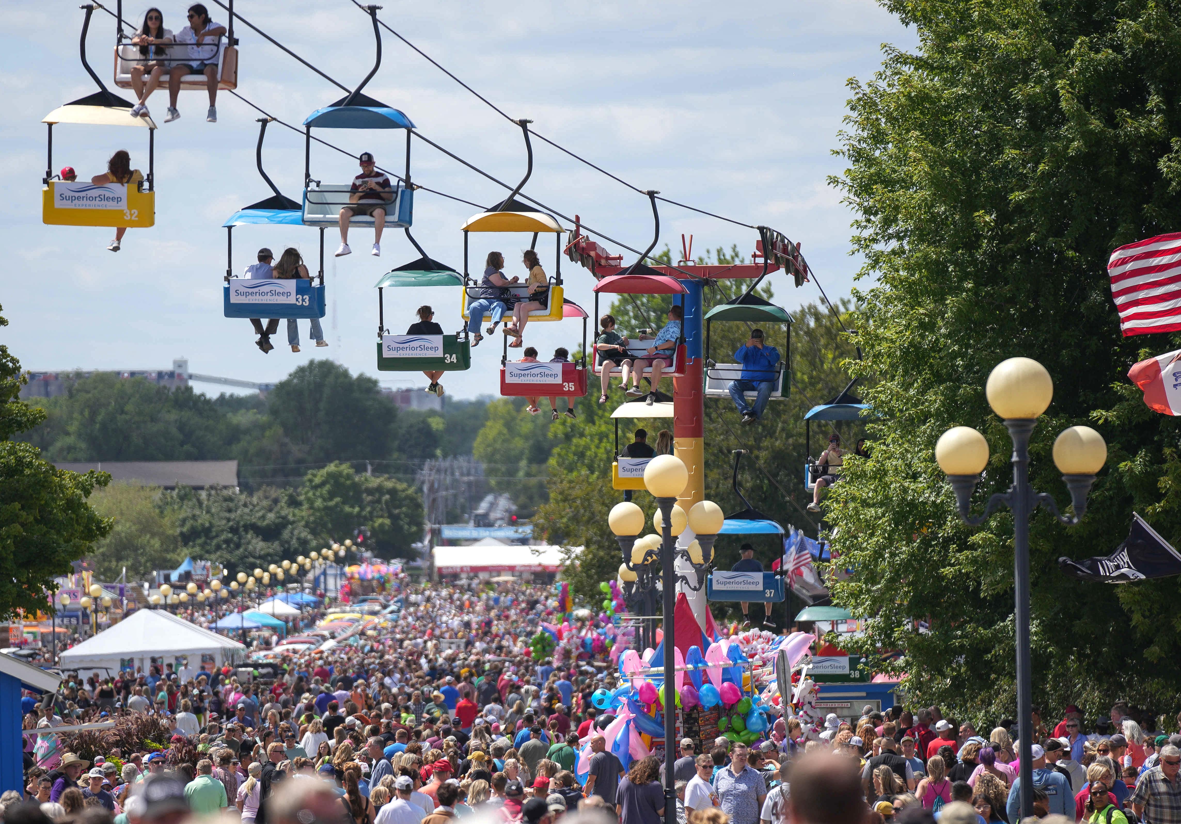 A large crowd underneath the skyglider on the Grand Concourse of the Iowa State Fair. 