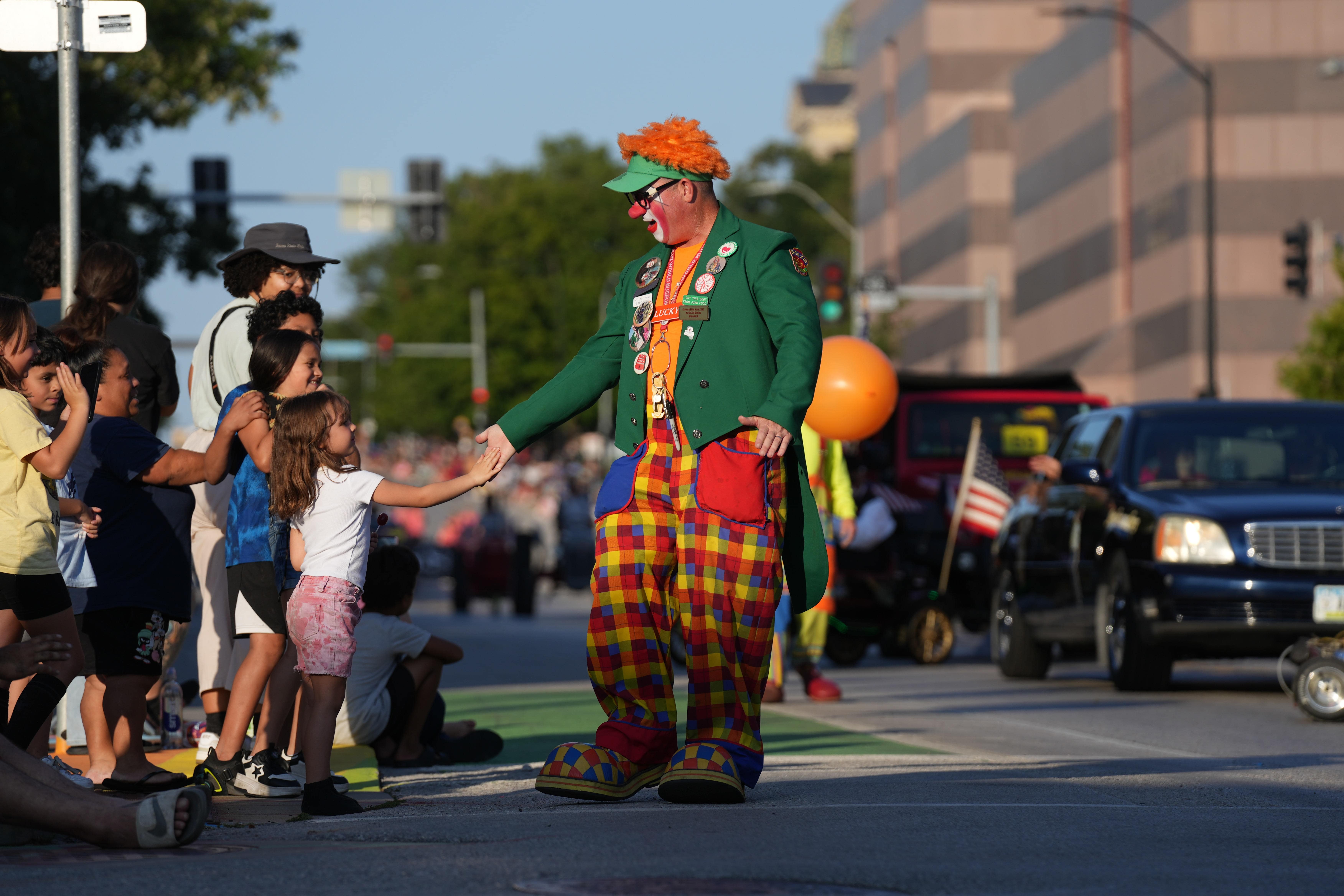 A dapper looking clown greets the crowd at the 2024 Iowa State Fair.