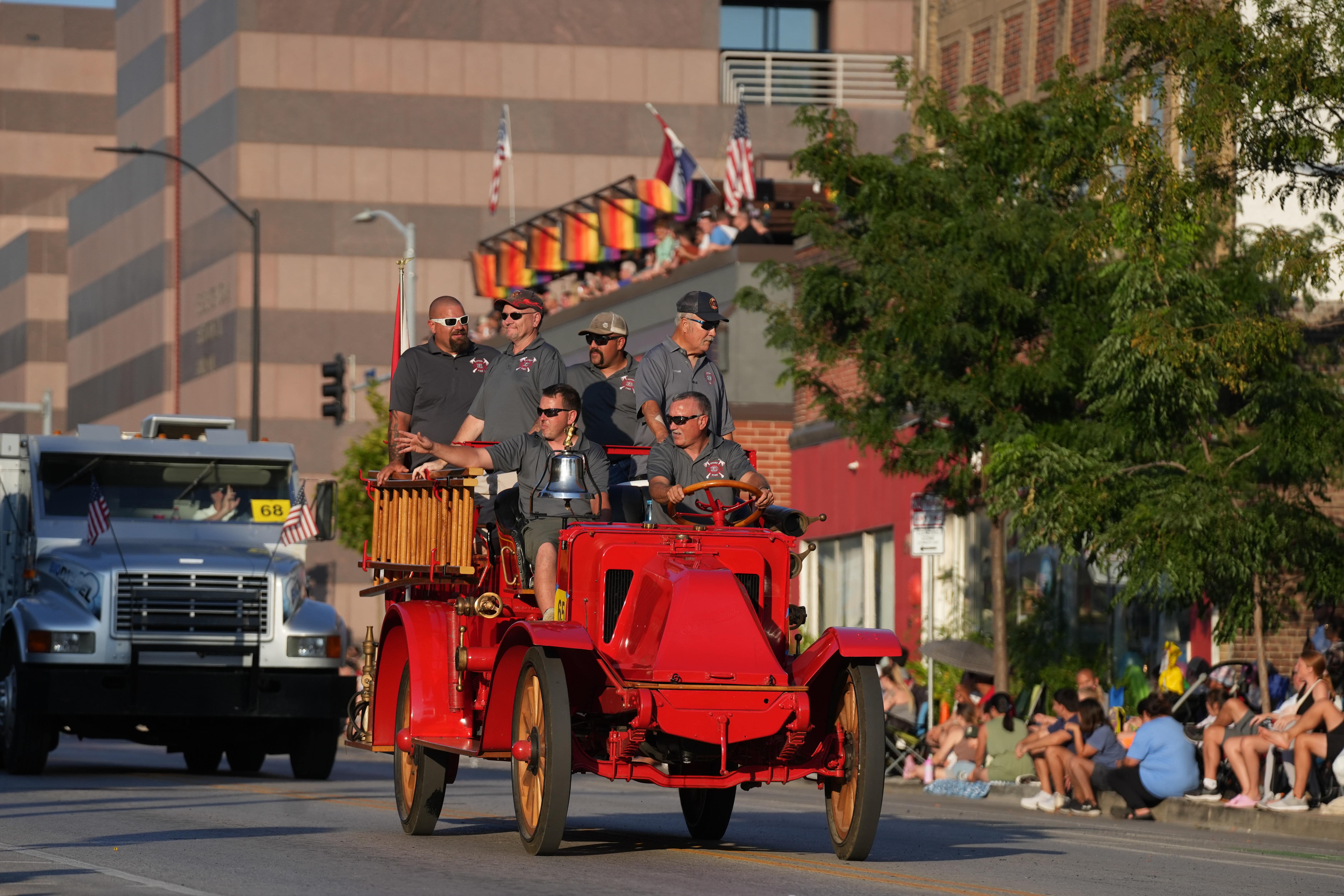 The Stuart Fire Department on a vintage fire engine.