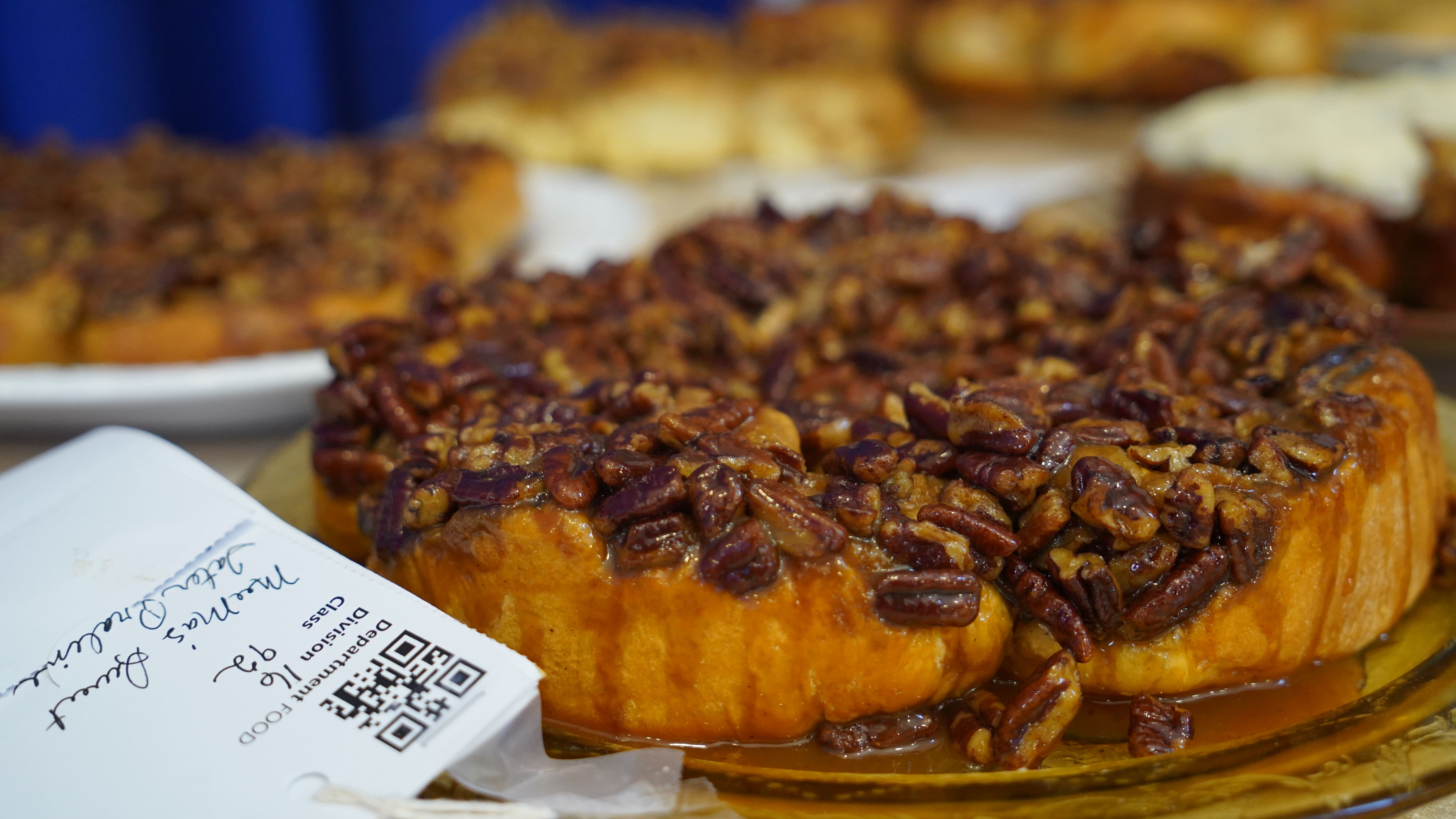 Nut topped cinnamon roll at the Best Cinnamon Roll Challenge 