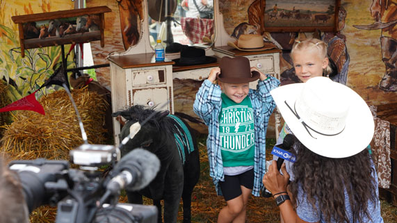 Interviewing two young girls at the cowboy bootcamp