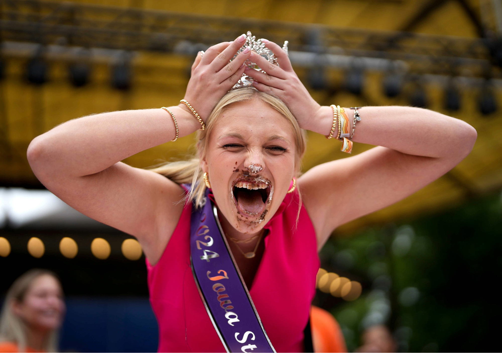 Iowa State Fair Queen Elli Clarke participating in the pie eating contest