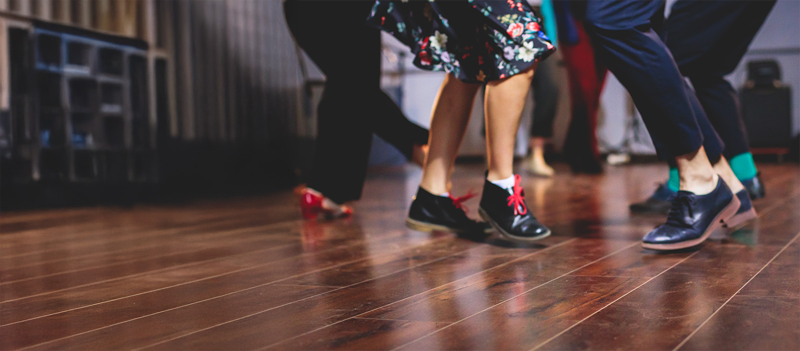 peole dancing at a dance hall