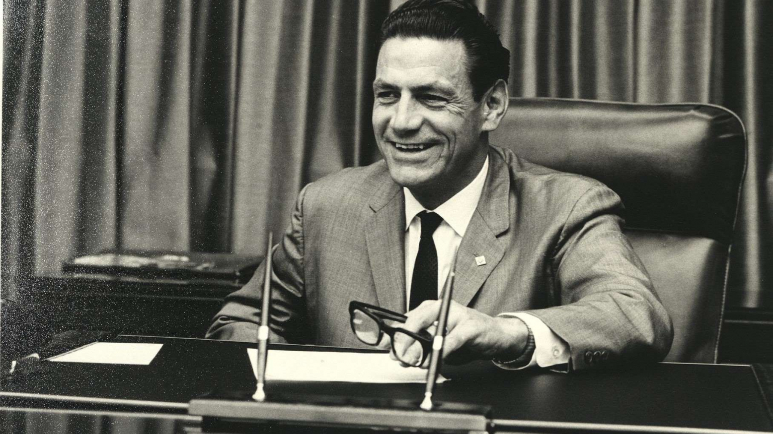 Harold Hughes at desk