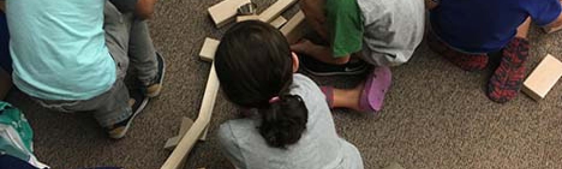 image of children playing with ramps and pathways 