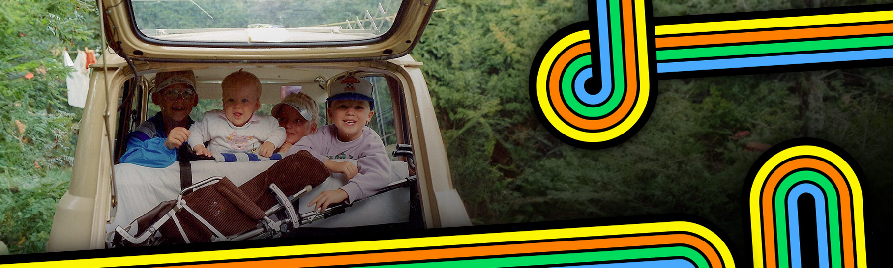 Vintage photo of kids traveling in the back of a car