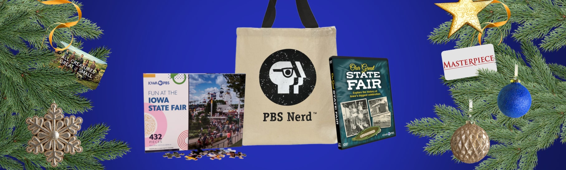 PBS nerd tote, Iowa State Fair puzzle and Our Great State Fair DVD surrounded by evergreen branches and Christmas tree ornaments