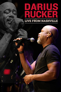 Music artist, Darius Rucker sings passionately into a microphone with eyes closed.