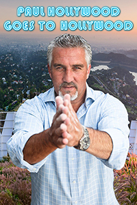 Host, Paul Hollywood faces the camera with palms together pointing at the camera -- the city of Hollywood, and the famous Hollywood sign at his back.