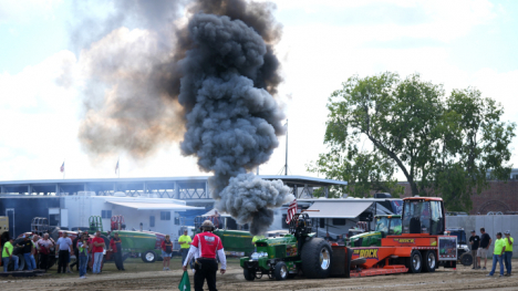 truck and tractor show with smoking tractor