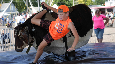 Boy riding a mechanical bull