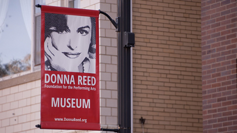 A banner of Donna Reed's portrait.