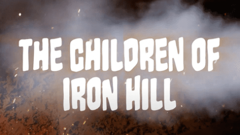 Text that reads The Children of Iron Hill with smoke and fire behind it