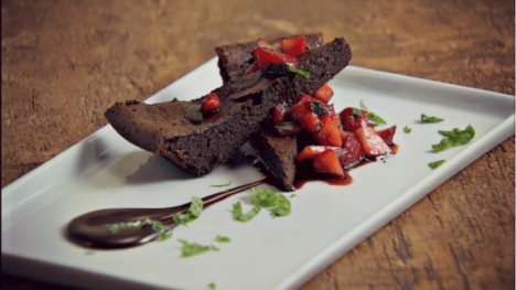 flourless chocolate cake covered in strawberries