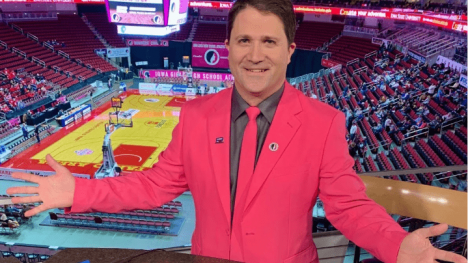 Paul Yeager announcing high school girls basketball in his hot pink suit