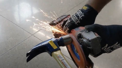 Saw used on hammer causing sparks