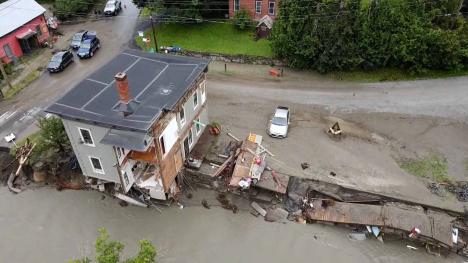 An aerial view of a storm damaged house.