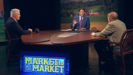 Chris Robinson, Paul Yeager, and Ernie Goss at the Market to Market desk.