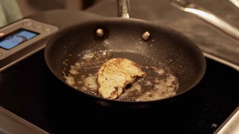 Lab-grown meat in a skillet.